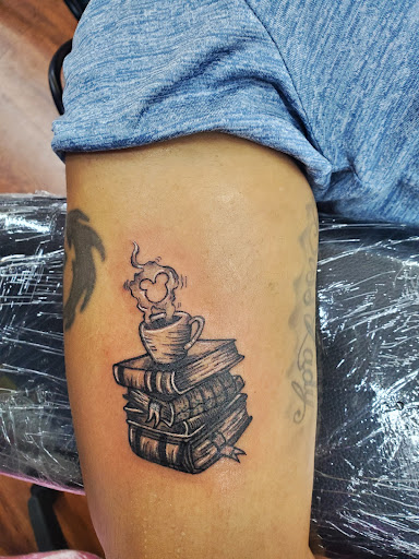 Explore lips tattoo ideas, creative tattoo ideas in Cocoa, available at Rorschach Tattoo Shop and Piercing Studio