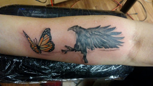 Find in between breast tattoo ideas for your next unique tattoo in Peru at Inked Memories Tattoo Company