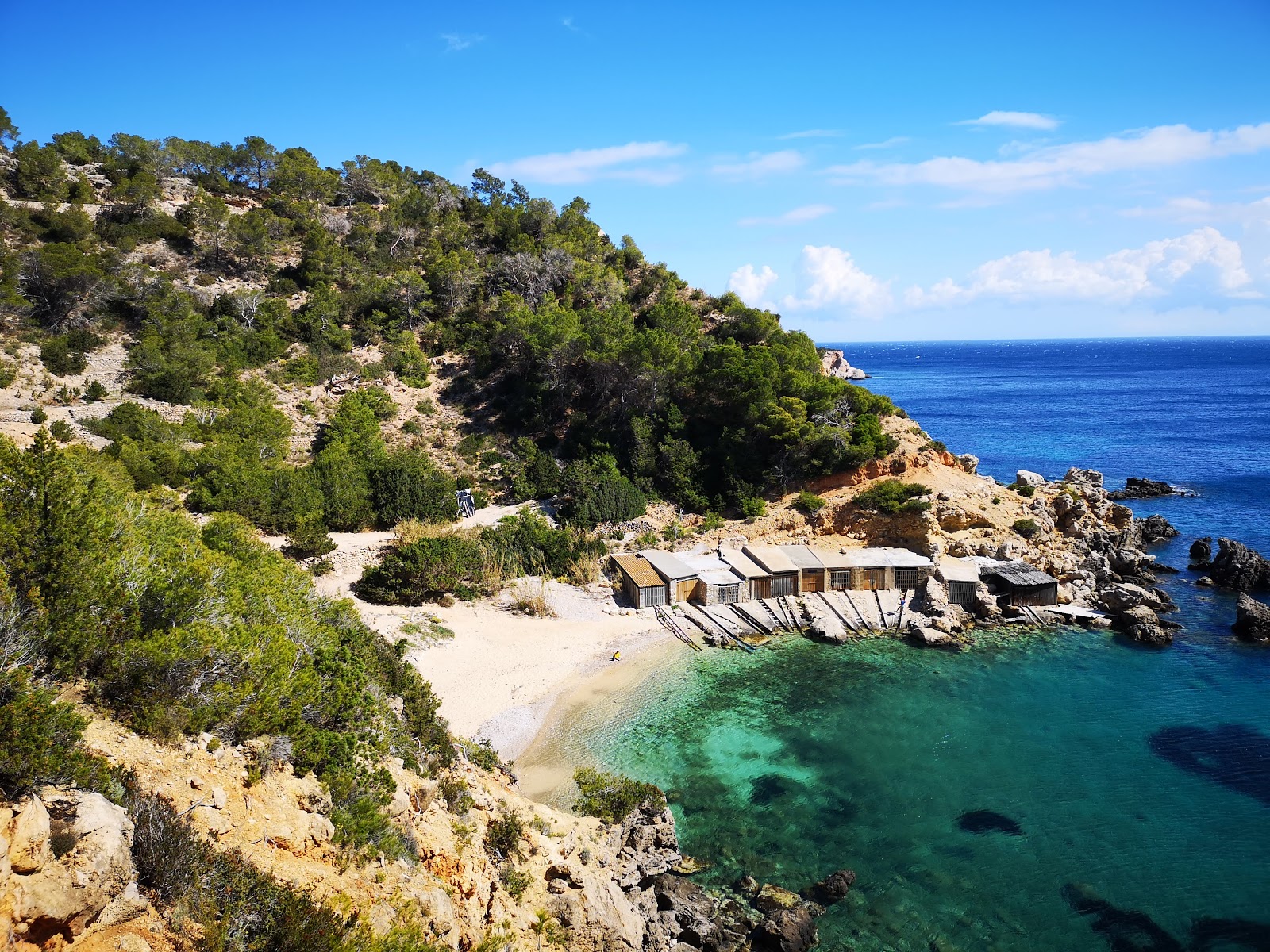 Photo of Cala D'en Serra with blue pure water surface