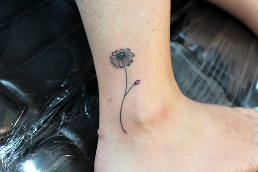 Explore cartoon tattoo ideas for men, creative tattoo ideas in Fort Myers, available at Tiger Lotus Tattoo and Piercing