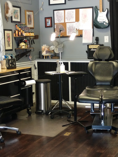 Find in between boob tattoo ideas for your next unique tattoo in Mchenry at Art and Soul Tattoo Company