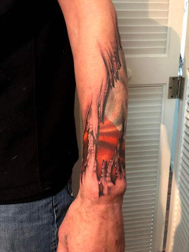 Explore florida tattoo ideas, creative tattoo ideas in Kingsford, available at Deft Tattoo Studio
