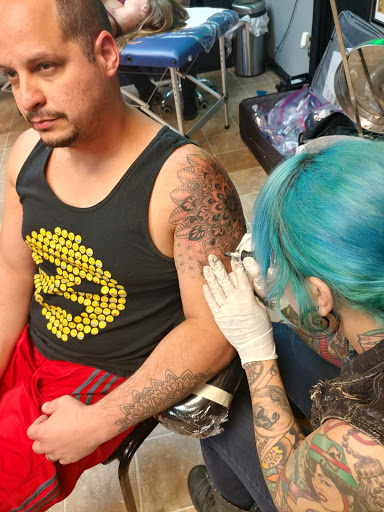 Explore lower back tattoo ideas, creative tattoo ideas in Kansas City, available at Revelation Tattoo