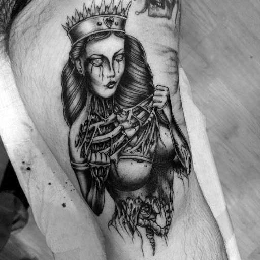 Explore 90s tattoo ideas, creative tattoo ideas in Ridge, available at Masquerade Tattoo Shop