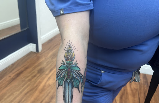 Explore mens country tattoo ideas, creative tattoo ideas in Cocoa, available at Rorschach Tattoo Shop and Piercing Studio