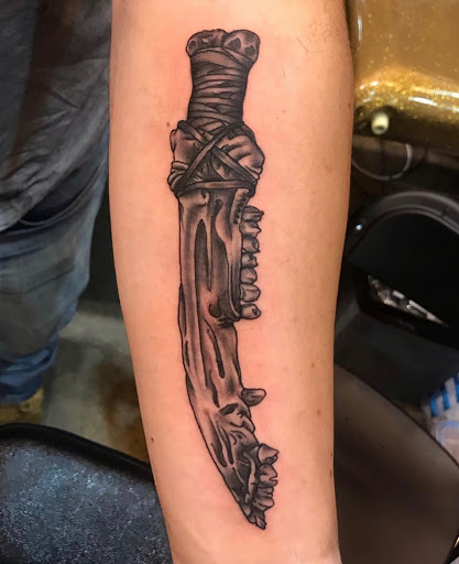 Explore skull forearm tattoo ideas, creative tattoo ideas in Dayton, available at 33 Lions Tattoo