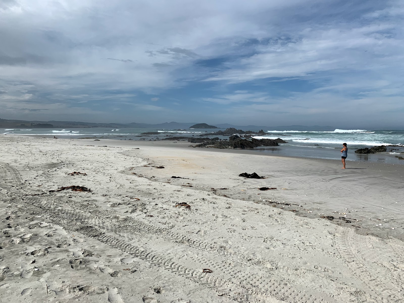 Fotografija Taieri Mouth Beach z svetel pesek površino
