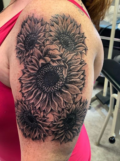 Explore behind ear tattoo ideas, creative tattoo ideas in Hudson Falls, available at ALTERED ADDICTION TATTOOS