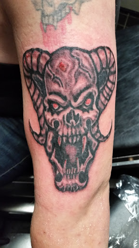 Explore good ideas for a cover up tattoo, creative tattoo ideas in Erie, available at EliKingInk