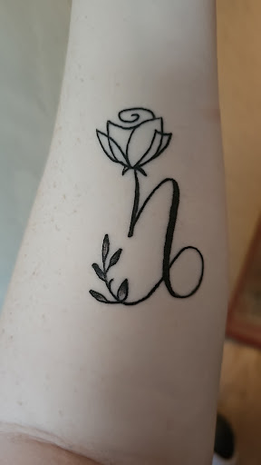 Explore mother daughter flower tattoo ideas, creative tattoo ideas in Lima, available at White Wizard Tattoo & Body Piercing