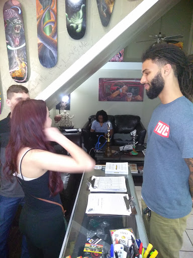 Explore black couple tattoo ideas, creative tattoo ideas in Atlanta, available at Iron Palm Tattoos & Body Piercing Atlanta