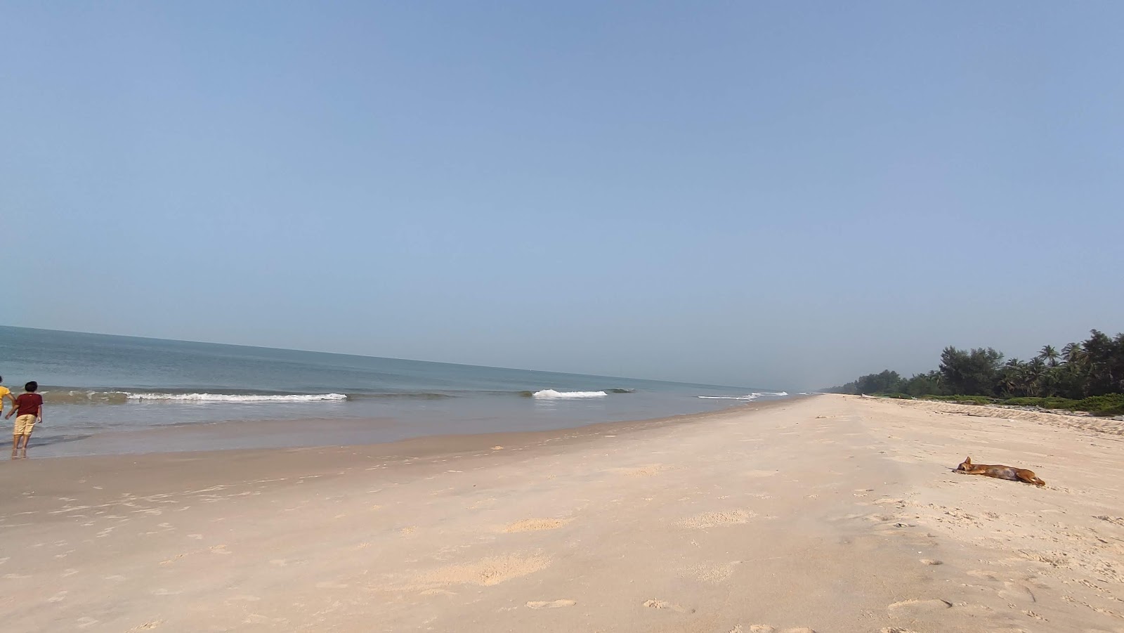 Photo de Koravadi Beach avec droit et long