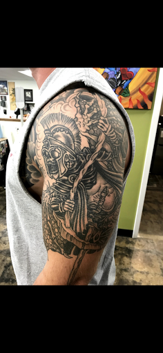 Explore wrestling tattoos ideas, creative tattoo ideas in Sioux Falls, available at Heart Tattoo