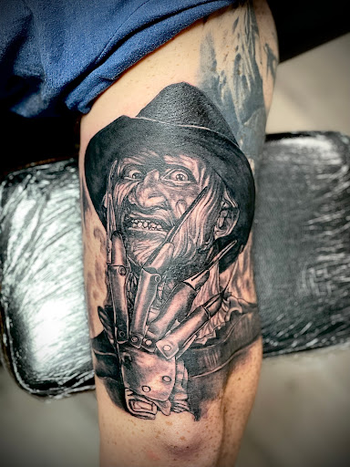 Explore black and white tattoo ideas for men, creative tattoo ideas in Florence, available at Rising Sons Tattoo Florence