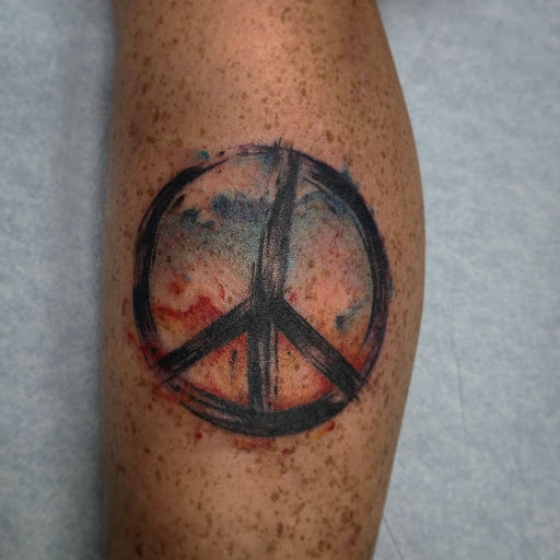 Explore trash polka tattoo ideas, creative tattoo ideas in Lewisburg, available at Rose and Dagger Tattoo