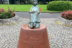 Statue of the Girl with Red Shoes image