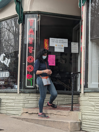 Explore rose thigh tattoo ideas, creative tattoo ideas in Perkasie, available at Black Cat Collective