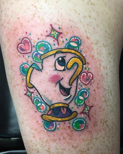 Explore cover up tattoo ideas on thigh, creative tattoo ideas in Greenfield, available at Tattoos In Time Studio