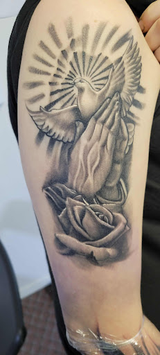 Explore small book tattoo ideas, creative tattoo ideas in Angola, available at Hoodlum Ink