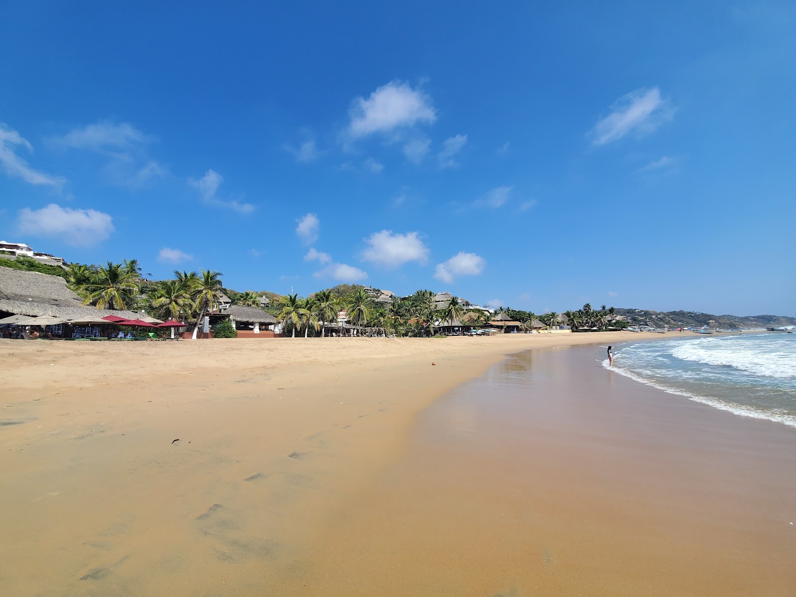 Foto de Playa San Agustinillo con brillante arena fina superficie