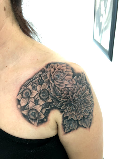 Explore bouquet tattoo ideas, creative tattoo ideas in Kent, available at Ivy Ink Tattoo