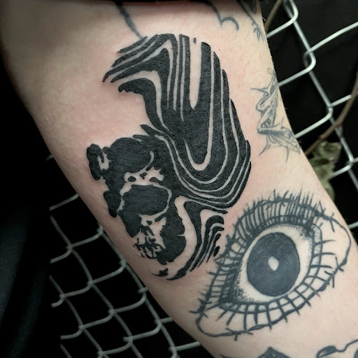 Explore flower wrist tattoo ideas, creative tattoo ideas in Buffalo, available at True Gloom Tattoo Studio