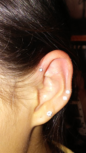 Find between breast tattoo ideas for your next unique tattoo in Merrick at Wyld Chyld Tattoo