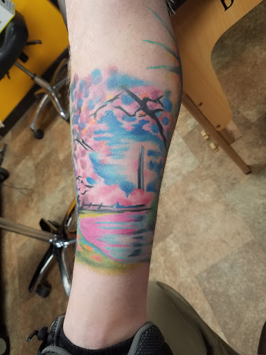 Explore traditional neck tattoo ideas, creative tattoo ideas in Powell, available at Hummingbird Tattoo Studio