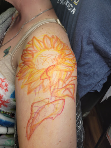 Explore skull and rose tattoo ideas, creative tattoo ideas in Anniston, available at Lucid Dreams Tattoos and Piercings