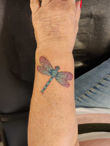 Explore butterfly flower tattoo ideas, creative tattoo ideas in Hebron, available at Explosive Ink Tattoo