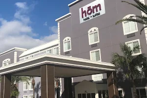h?m hotel + suites a Trademark Collection Hotel by Wyndham image