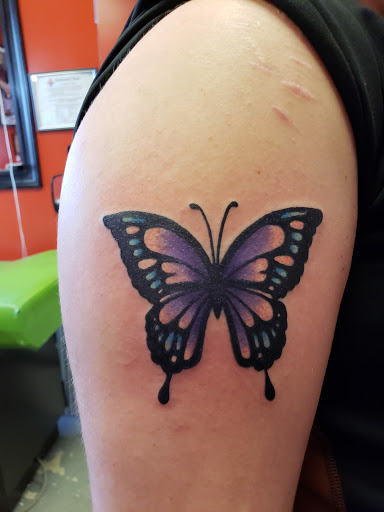 Explore music tattoo ideas, creative tattoo ideas in New Baltimore, available at Inkslingers Tattoos