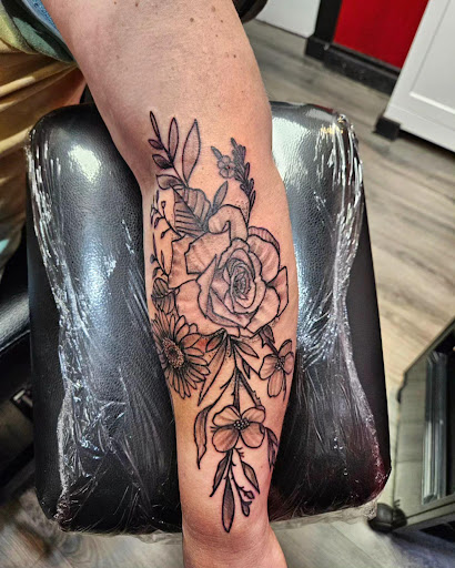 Explore knee scar tattoo ideas, creative tattoo ideas in Cumberland, available at Queen City Ink