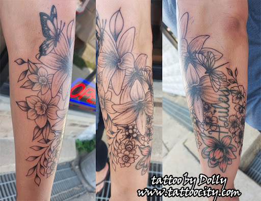 Explore watercolor flower tattoo ideas, creative tattoo ideas in Lockport, available at Tattoo City by Larry Brogan