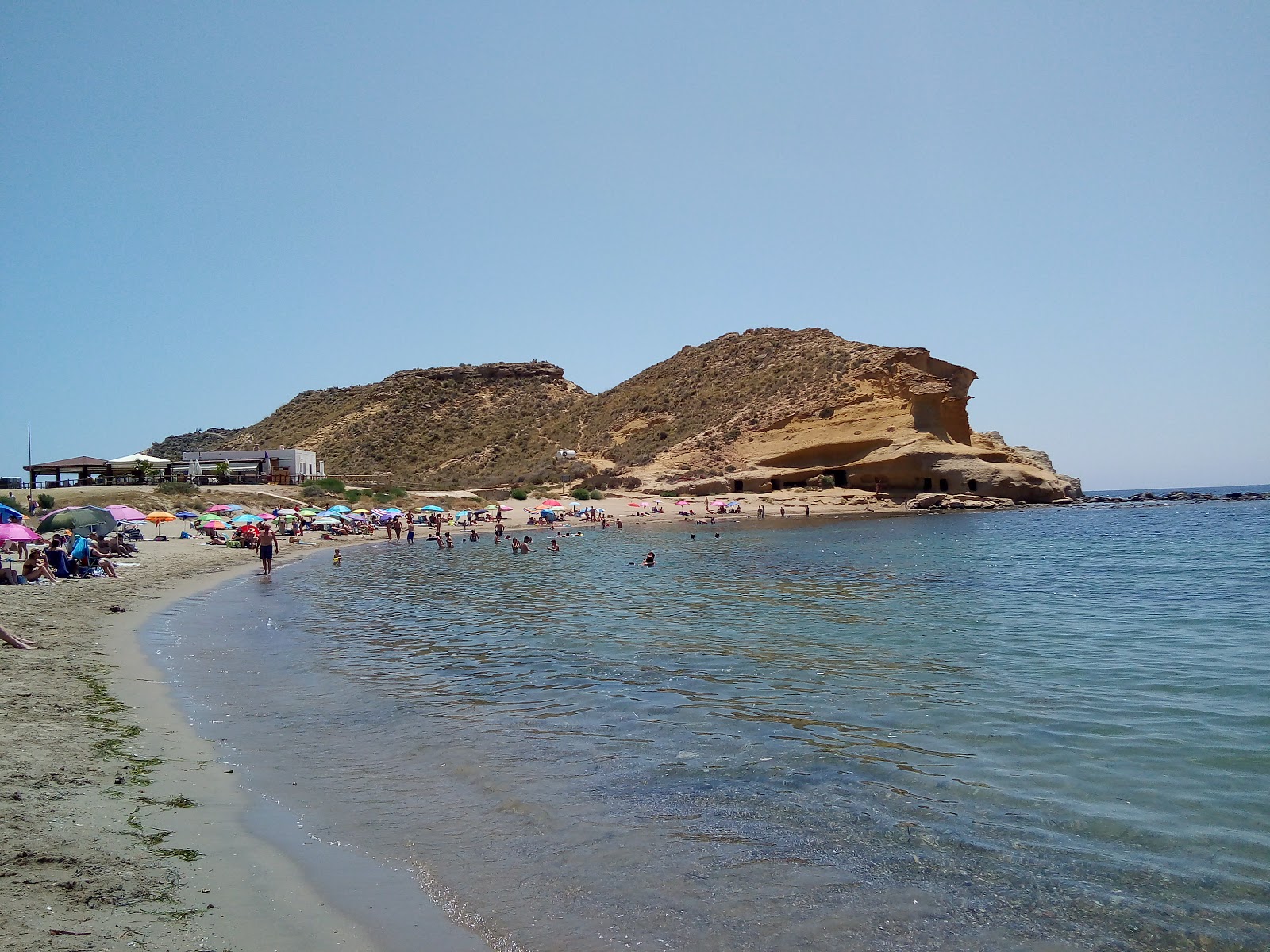 Foto di Spiaggia Cocedores con una superficie del sabbia marrone