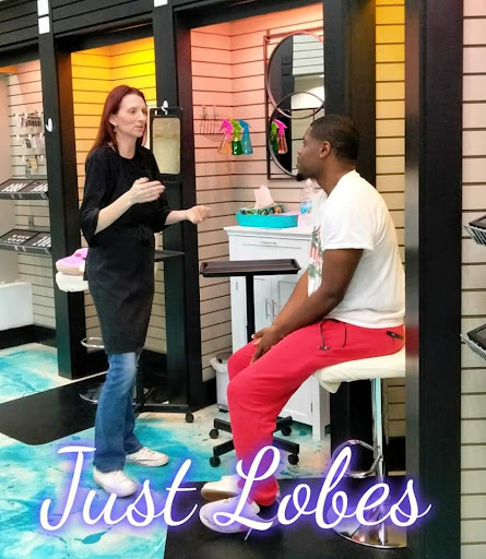 Explore lion and cub tattoo ideas, creative tattoo ideas in Warner Robins, available at Just Lobes Family Ear Piercing