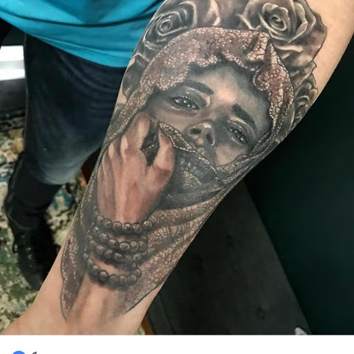 Explore nike tattoo ideas, creative tattoo ideas in Charlotte, available at Canvas Tattoo & Art Gallery