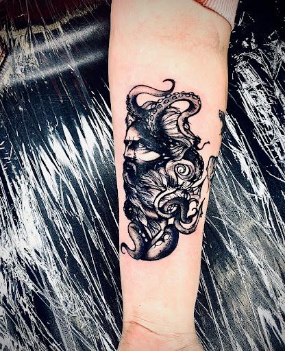 Explore mermaid tattoo ideas for females, creative tattoo ideas in Lake City, available at Crooked Spines Tattoo Studio