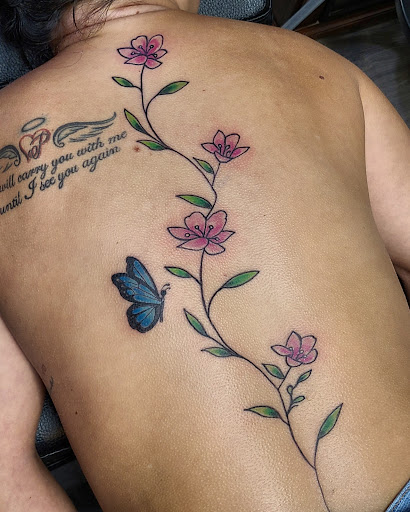 Explore cover up tattoo ideas female back, creative tattoo ideas in Cumberland, available at Queen City Ink