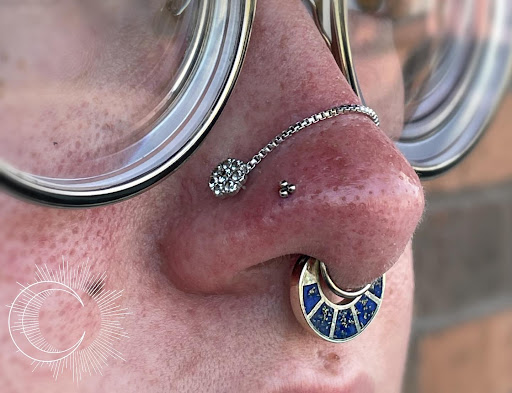 Explore tangled tattoo ideas, creative tattoo ideas in Appleton, available at Celestial Piercing- Inside of Big Guns Tattoo