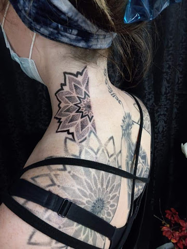 Explore flower garden tattoo ideas, creative tattoo ideas in Mebane, available at The Cardinal Skin Art & Gallery