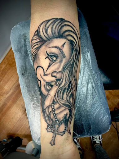 Explore dark knight tattoo ideas, creative tattoo ideas in Hudson, available at Twisted Canvas Tattoo and Art Studio