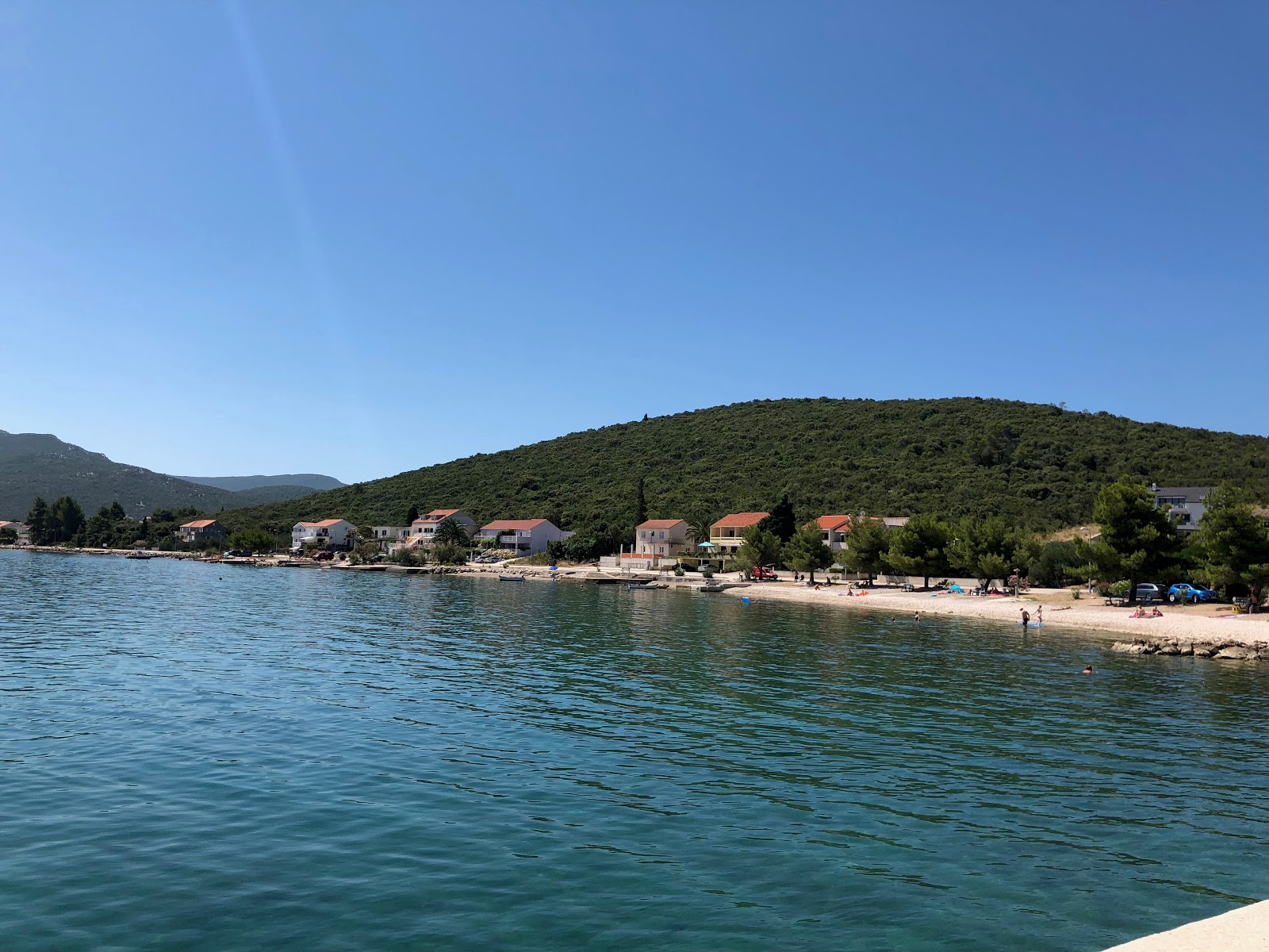 Photo de Drace beach avec petite baie