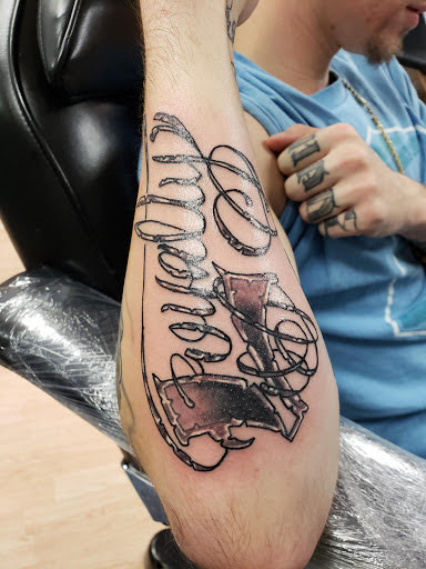 Explore tattoo ideas for dead dog, creative tattoo ideas in Flint, available at Studio 42 Tattoo