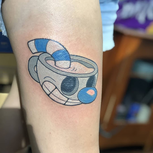 Explore hairdresser tattoo ideas, creative tattoo ideas in Reno, available at Evolution Tattoo