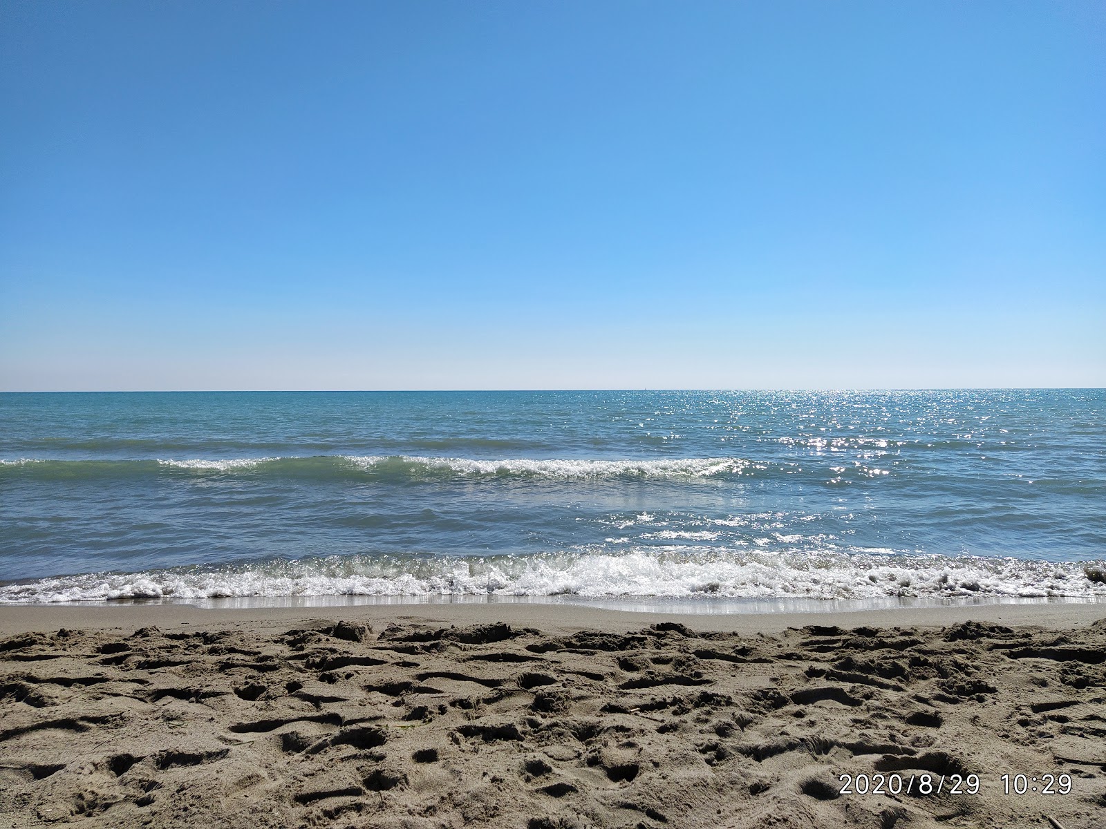 Photo de Lido Terzo Madonna avec rivage droit, long