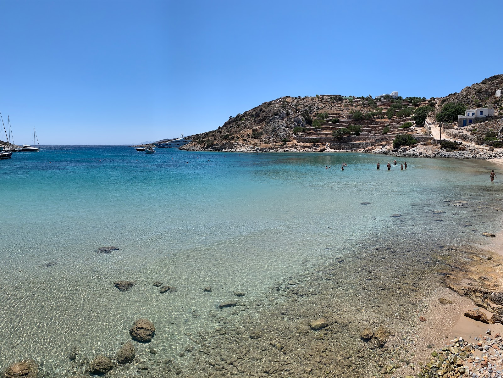 Foto van Mersini Beach met beige zand oppervlakte