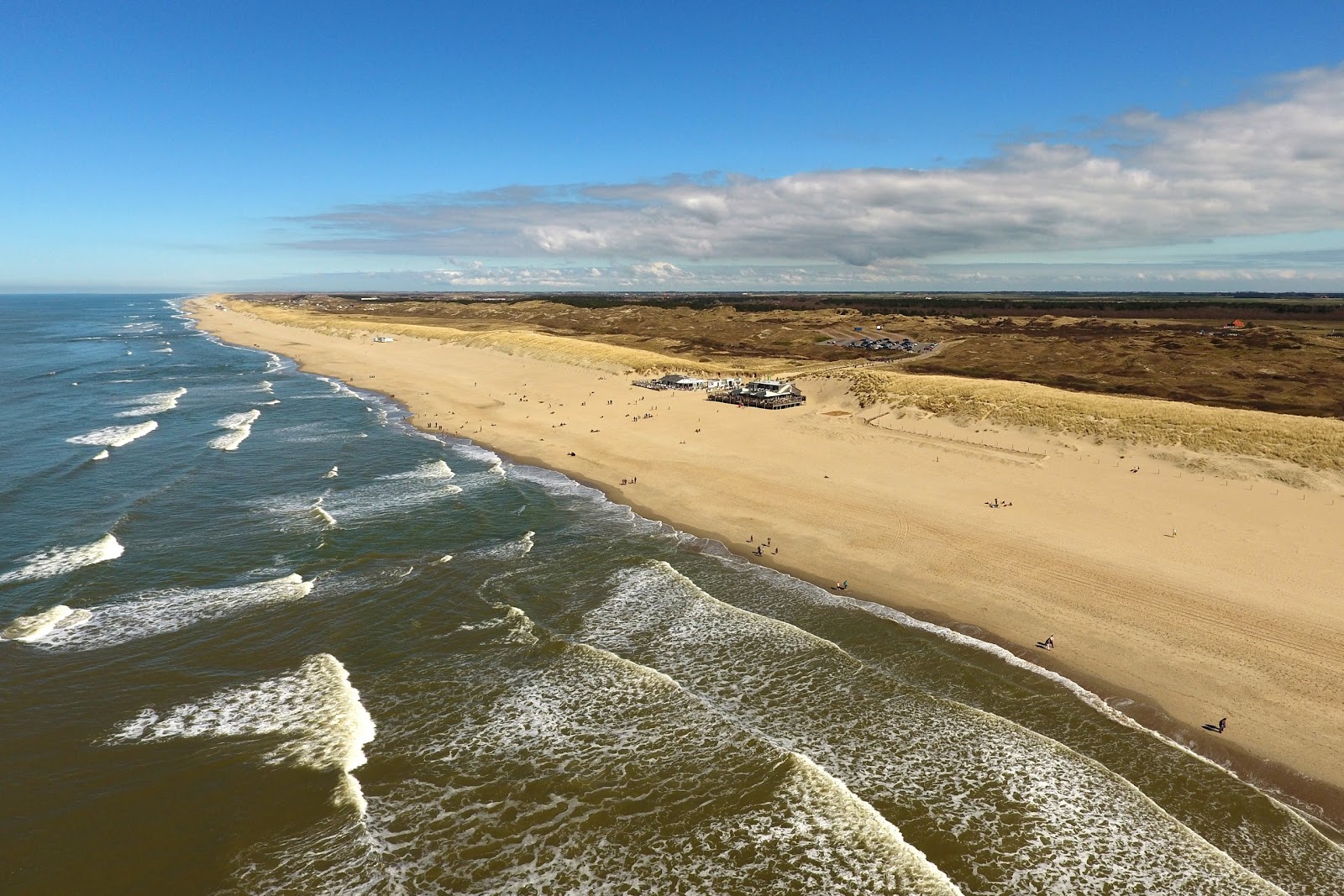 Fotografija Ecomare beach z svetel pesek površino