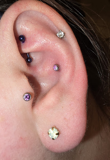 Explore dog print tattoo ideas, creative tattoo ideas in Plattsburgh, available at One Flight Up Body Piercing