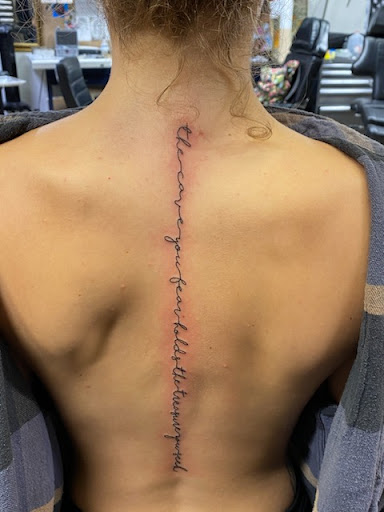 Explore small red tattoos ideas, creative tattoo ideas in Sarasota, available at SEVEN SINS Tattoo Studio